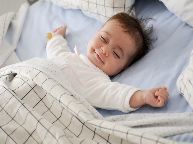 baby sleeping without any fear plate full of delight