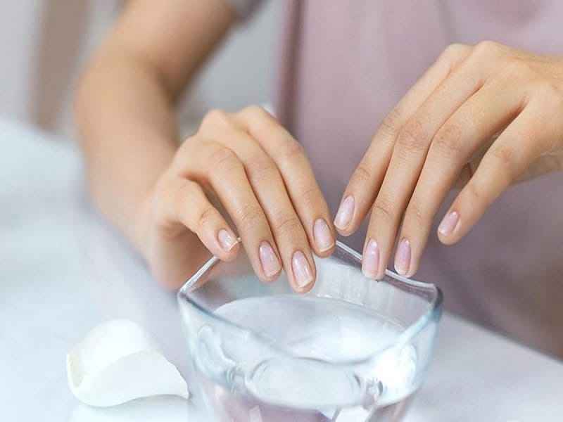 hands in warm water for manicure