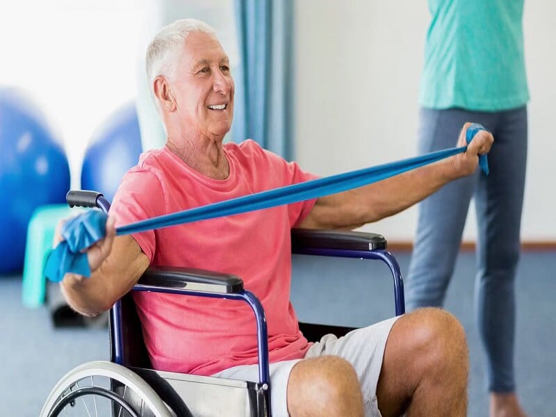 man in wheelchair exercising