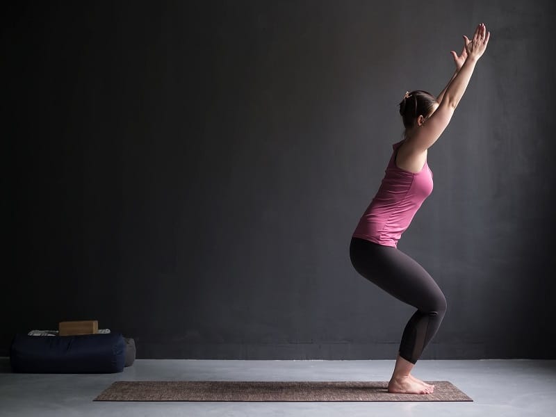 Woman Practicing Yoga, Doing Chair Exercise, Utkatasana Pose