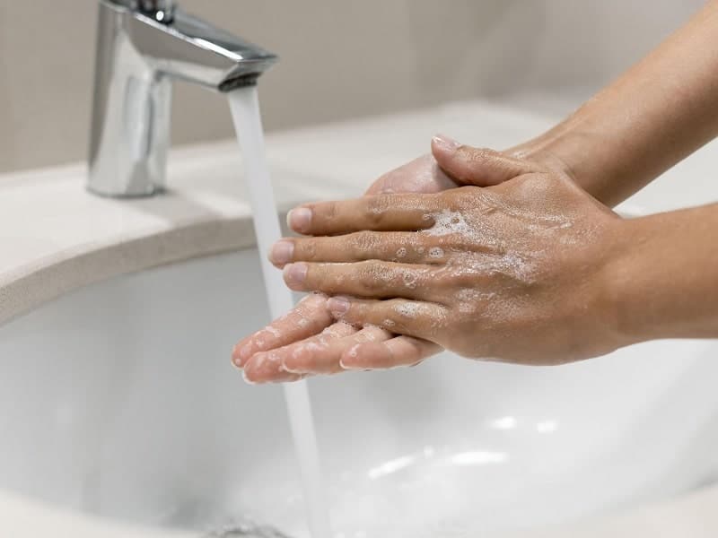 person-washing-hands-close-up